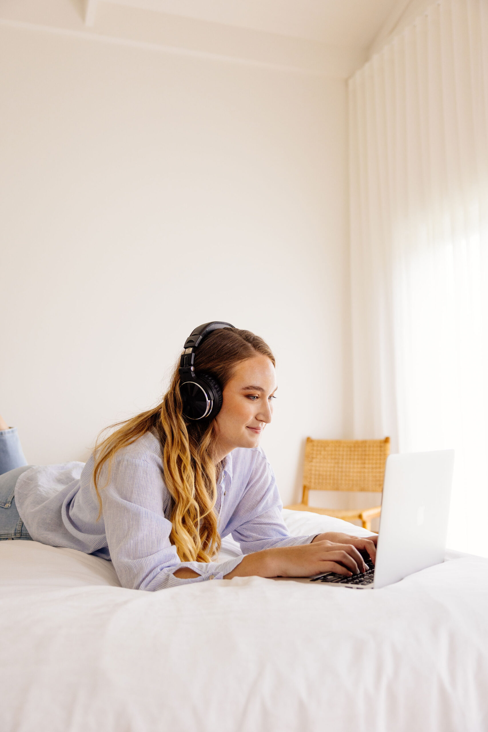 A social media manager reviewing marketing performance metrics on her computer.